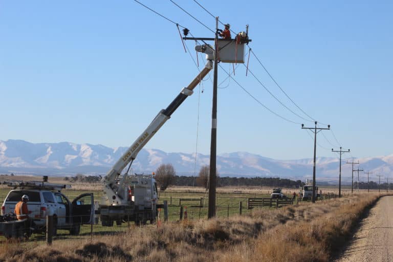 Technicians working on powerlines.